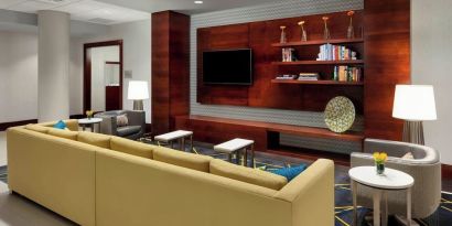 Lobby lounge with comfortable seating, perfect for coworking at Courtyard Boston Cambridge.