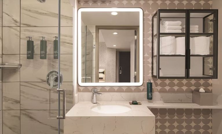 Private guest bathroom with shower and free toiletries at DoubleTree By Hilton New York Midtown Fifth Ave.