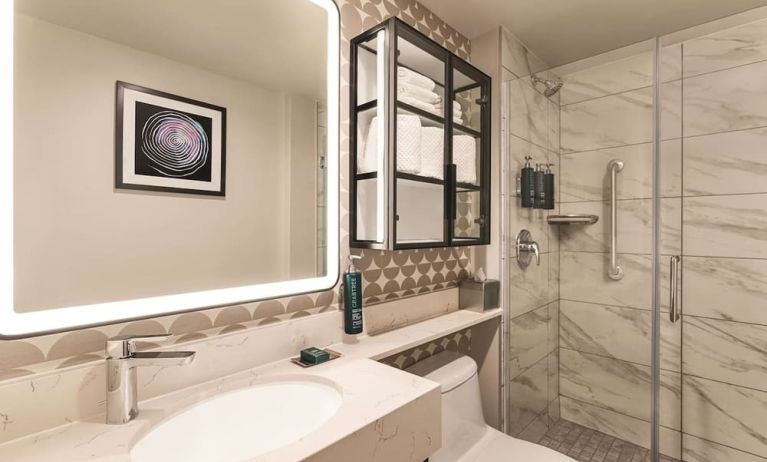 Private guest bathroom with shower and free toiletries at DoubleTree By Hilton New York Midtown Fifth Ave.