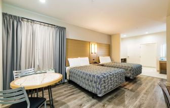 Day use twin room with workspace at Palace Inn Blue IAH East.