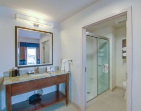 Private guest bathroom with shower and free toiletries at Hampton Inn & Suites Trophy Club - Fort Worth North, TX.