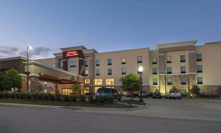 Hotel exterior and parking area at Hampton Inn & Suites Trophy Club - Fort Worth North, TX.
