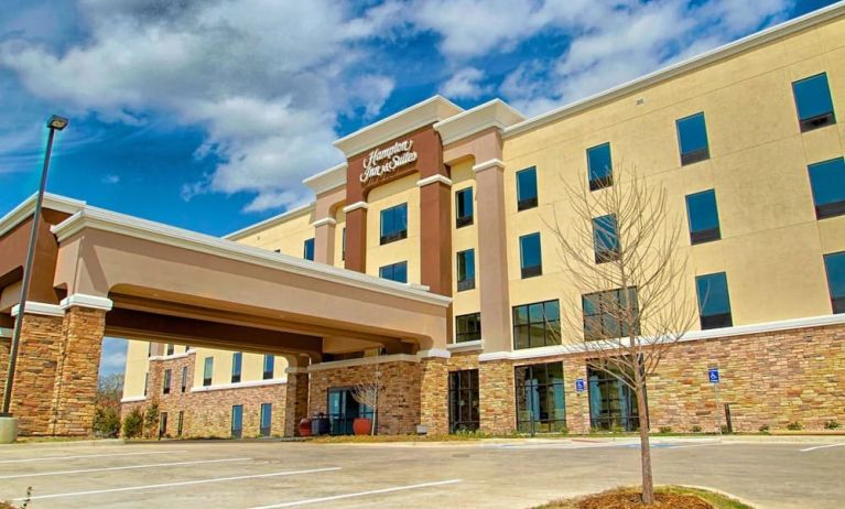 Hotel entrance and parking area at Hampton Inn & Suites Trophy Club - Fort Worth North, TX.