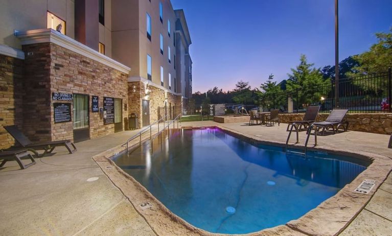 Outdoor pool with lounge chairs at Hampton Inn & Suites Trophy Club - Fort Worth North, TX.