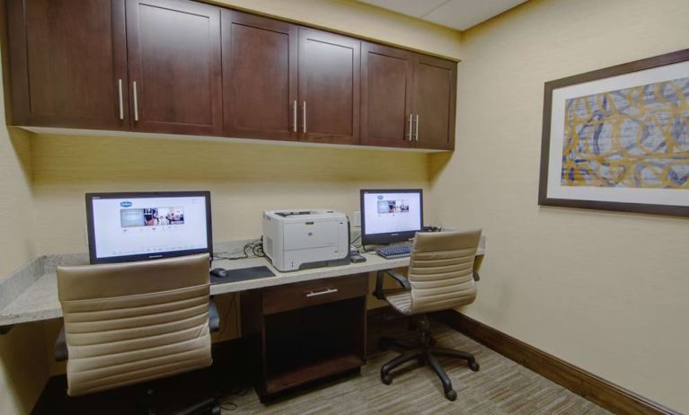 Business center with computers, printer and ergonomic chairs at Hampton Inn & Suites Trophy Club - Fort Worth North, TX.