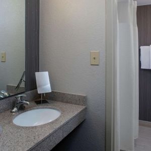 Private guest bathroom with shower and free toiletries at Sonesta Select Atlanta Norcross I-85.