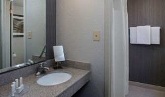 Private guest bathroom with shower and free toiletries at Sonesta Select Atlanta Norcross I-85.