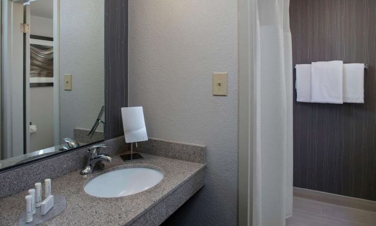 Private guest bathroom with shower and free toiletries at Sonesta Select Atlanta Norcross I-85.