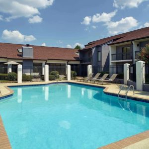 Outdoor pool with lounge chairs at Sonesta Select Atlanta Norcross I-85.