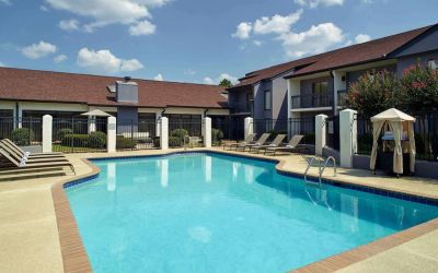 Outdoor pool with lounge chairs at Sonesta Select Atlanta Norcross I-85.