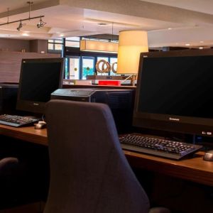 Business center with computers, printer and ergonomic chairs at Sonesta Select Atlanta Norcross I-85.