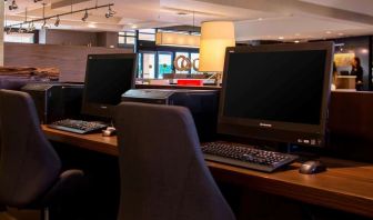 Business center with computers, printer and ergonomic chairs at Sonesta Select Atlanta Norcross I-85.