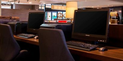 Business center with computers, printer and ergonomic chairs at Sonesta Select Atlanta Norcross I-85.