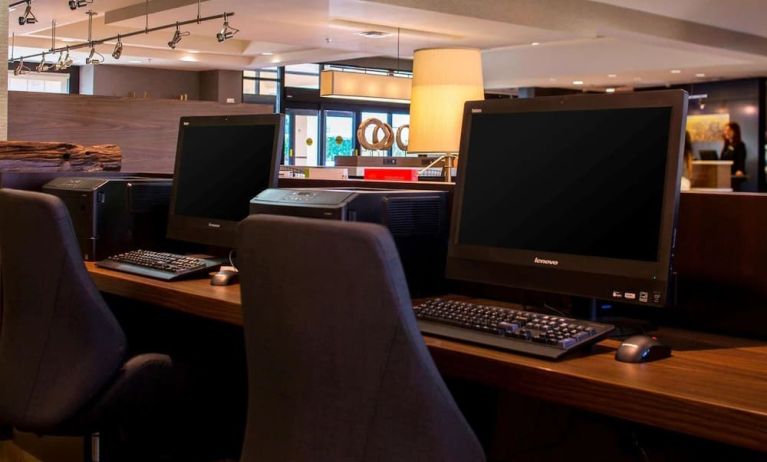 Business center with computers, printer and ergonomic chairs at Sonesta Select Atlanta Norcross I-85.