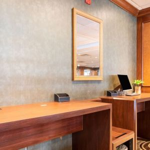 Lobby workspace with computer and printer at Wyndham Omaha. 