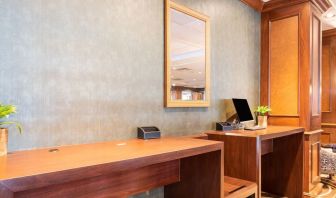 Lobby workspace with computer and printer at Wyndham Omaha. 