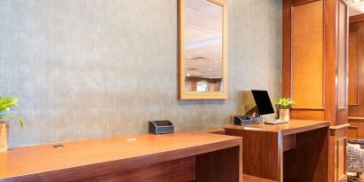 Lobby workspace with computer and printer at Wyndham Omaha. 