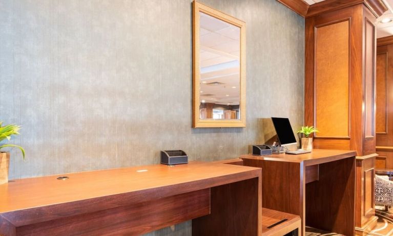Lobby workspace with computer and printer at Wyndham Omaha. 