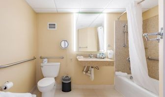 Private guest bathroom with combined shower and tub at Wyndham Omaha.