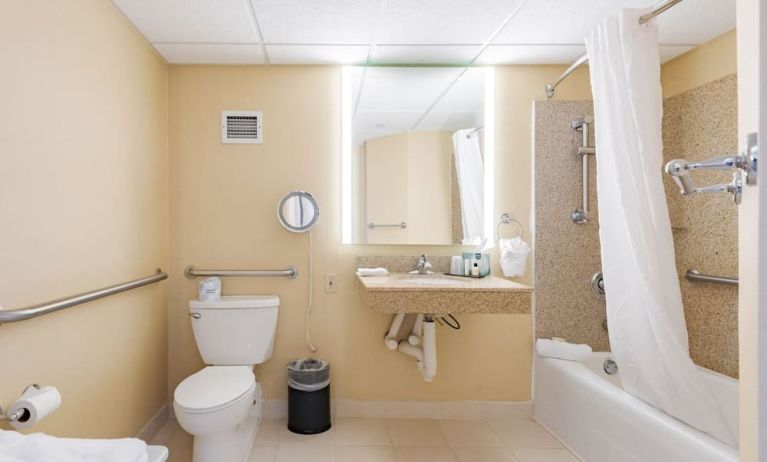 Private guest bathroom with combined shower and tub at Wyndham Omaha.