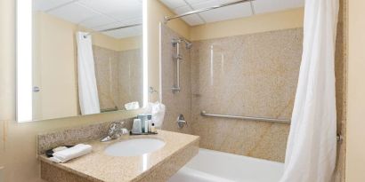 Private guest bathroom with free toiletries at Wyndham Omaha.
