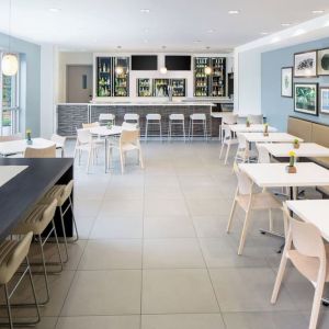 Dining area an on-site bar at Element Miami International Airport.
