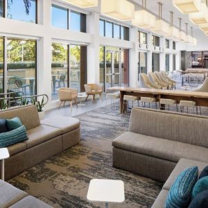Lobby lounge seating and workspace at Element Miami International Airport.