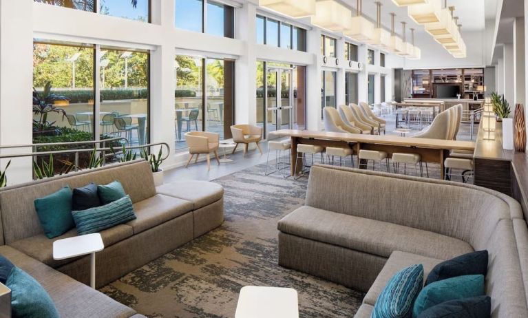 Lobby lounge seating and workspace at Element Miami International Airport.