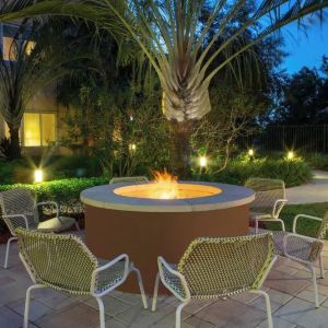 Outdoor lounge seating and fire pit at Element Miami International Airport.