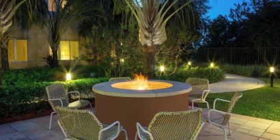 Outdoor lounge seating and fire pit at Element Miami International Airport.
