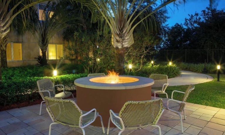 Outdoor lounge seating and fire pit at Element Miami International Airport.