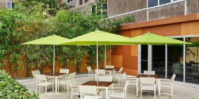 Hotel patio with seating at Element Miami International Airport.