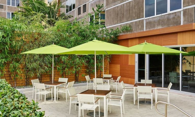 Hotel patio with seating at Element Miami International Airport.