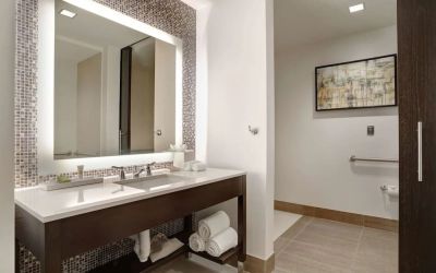Private guest bathroom with free toiletries at Hilton Dallas/ Plano Granite Park.