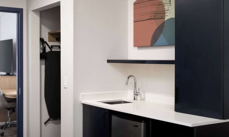 Kitchen and mini-fridge at Spark By Hilton Guelph.