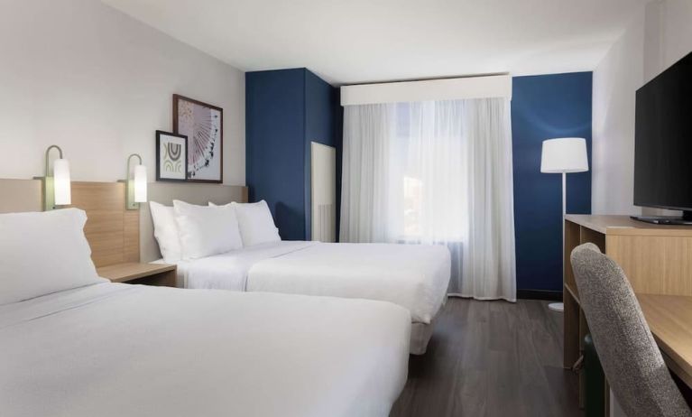 Day use room with queen beds and tv at Spark By Hilton Guelph.