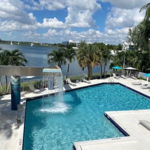 Refreshing outdoor pool with an amazing view of the lake at Pullman Miami Airport.