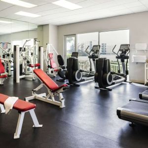 Fitness center with natural light at Pullman Miami Airport.