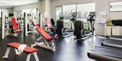 Fitness center with natural light at Pullman Miami Airport.