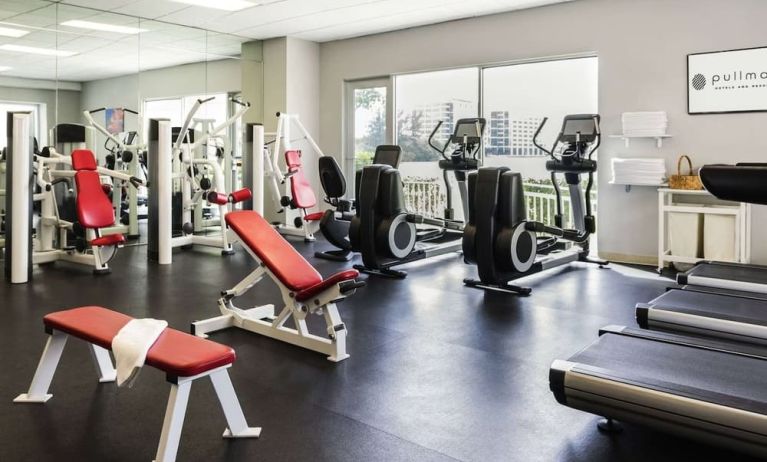 Fitness center with natural light at Pullman Miami Airport.