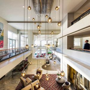 Lobby and coworking lounge at Pullman Miami Airport.
