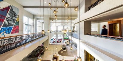 Lobby and coworking lounge at Pullman Miami Airport.