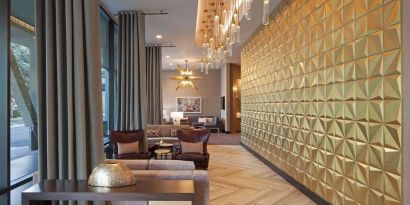 Lobby and coworking lounge at Homewood Suites By Hilton LAX Airport.