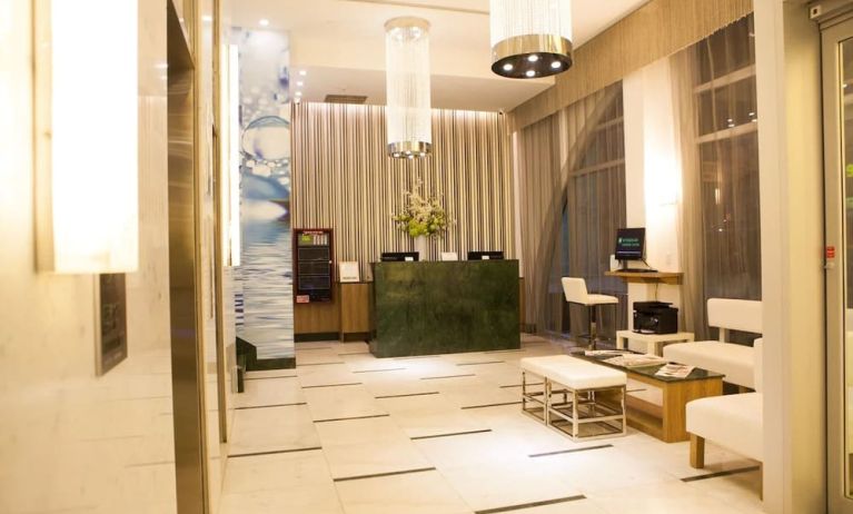 Hotel lobby and workspace at Wyndham Garden Brooklyn Sunset Park.