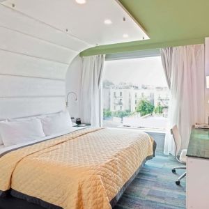 King room with comfortable bed and work desk at Wyndham Garden Brooklyn Sunset Park.