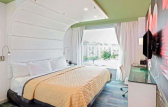 King room with comfortable bed and work desk at Wyndham Garden Brooklyn Sunset Park.