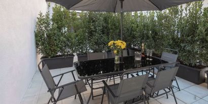 Outdoor terrace at Aiello Hotels - CityLife Apartments.