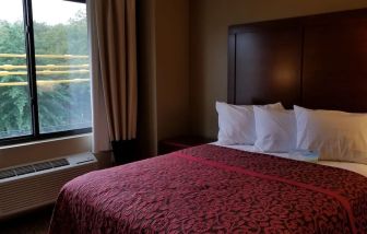 Day use room with large window and private bathroom at Days Inn By Wyndham Brooklyn Marine Park.