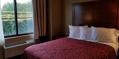 Day use room with large window and private bathroom at Days Inn By Wyndham Brooklyn Marine Park.