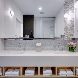 Private guest bathroom with shower and free toiletries at Nu Hotel - Brooklyn.